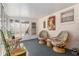 Inviting sunroom with comfortable seating, bright decor, and windows overlooking the yard at 9581 Sw 85Th Ave # D, Ocala, FL 34481