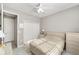Serene bedroom features a ceiling fan, and a large window that offers natural light at 9974 Sw 88Th Loop, Ocala, FL 34481