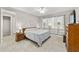 Bright bedroom features a comfortable bed, natural light, and classic wooden furniture at 9974 Sw 88Th Loop, Ocala, FL 34481