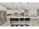 Modern kitchen boasts stainless steel appliances, granite countertops, and a central island with bar stool seating at 9974 Sw 88Th Loop, Ocala, FL 34481