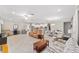 Spacious open layout with kitchen, living, and dining areas, enhanced by natural light and neutral color palette at 9974 Sw 88Th Loop, Ocala, FL 34481