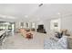 Spacious living room featuring neutral tones, recessed lighting, and an open concept design at 9974 Sw 88Th Loop, Ocala, FL 34481