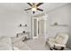 Bright home office features modern decor, a ceiling fan, neutral colors, and a comfortable seating area at 9974 Sw 88Th Loop, Ocala, FL 34481