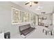Relaxing sun room with comfortable seating, ceiling fans, and multiple windows for natural light at 9974 Sw 88Th Loop, Ocala, FL 34481