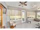 Inviting sunroom with neutral decor and many windows that provide bright, natural light at 9974 Sw 88Th Loop, Ocala, FL 34481