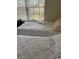 Bedroom featuring two twin beds with cozy white bedding and a window with a view at 10 Hickory Loop, Ocala, FL 34472