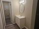 Clean bathroom featuring a vanity with cabinet, updated fixtures, and a well-lit mirror at 10040 Sw 98Th Ave, Ocala, FL 34481