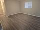 Bright bedroom with a window, neutral walls, and modern flooring, a perfect retreat at 10040 Sw 98Th Ave, Ocala, FL 34481
