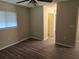 Inviting bedroom with natural light, a closet, and modern flooring for a relaxing atmosphere at 10040 Sw 98Th Ave, Ocala, FL 34481