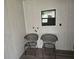 Potential laundry room area ready for appliances with utility hookups and seating at 10040 Sw 98Th Ave, Ocala, FL 34481