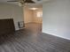 Open living room with modern flooring and neutral paint, creating a bright and inviting space at 10040 Sw 98Th Ave, Ocala, FL 34481