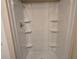 Modern shower stall showcasing built-in shelves and a clean, functional design at 10040 Sw 98Th Ave, Ocala, FL 34481