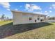 Exterior of home featuring manicured lawn with covered porch for relaxation and outdoor enjoyment at 10400 Sw 50Th Ct, Ocala, FL 34476