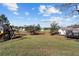Expansive backyard featuring a playground and trampoline, perfect for outdoor activities and Gathering fun at 10400 Sw 50Th Ct, Ocala, FL 34476