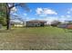 Large backyard with a covered patio, ideal for relaxation and entertaining guests outdoors at 10400 Sw 50Th Ct, Ocala, FL 34476