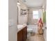 Cozy bathroom featuring a vanity with a sink, toilet, and shower and tub combo at 10400 Sw 50Th Ct, Ocala, FL 34476