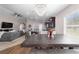 Spacious dining area with an open floor plan, a hanging chandelier, and views into the living room at 10400 Sw 50Th Ct, Ocala, FL 34476