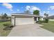 Inviting single-story home with a two-car garage and landscaped front yard at 10400 Sw 50Th Ct, Ocala, FL 34476