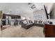 Spacious living room featuring an open floor plan, ceiling fan, and modern decor at 10400 Sw 50Th Ct, Ocala, FL 34476