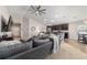 Open concept living room displaying stylish furnishings and view of the kitchen area at 10400 Sw 50Th Ct, Ocala, FL 34476