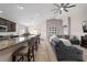Open concept living room and kitchen area with barstool seating at 10400 Sw 50Th Ct, Ocala, FL 34476