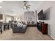 Bright living room boasts carpet flooring, vaulted ceilings, and stylish furnishings at 10400 Sw 50Th Ct, Ocala, FL 34476