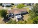 Aerial view of the house showing the backyard patio with gazebo, screened patio and roof at 11475 Sw 85Th Ave, Ocala, FL 34481