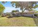 Backyard with lawn, patio, gazebo, and golf cart parked near the rear of the home at 11475 Sw 85Th Ave, Ocala, FL 34481
