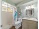 Well-lit bathroom with a walk-in shower and vanity sink at 11475 Sw 85Th Ave, Ocala, FL 34481