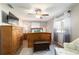 Spacious bedroom with wood floors, a ceiling fan, and a large window at 11475 Sw 85Th Ave, Ocala, FL 34481