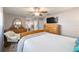 Cozy bedroom featuring a bed, television, and wood floors at 11475 Sw 85Th Ave, Ocala, FL 34481