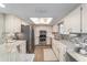 Well-lit kitchen featuring stainless appliances, modern backsplash, and granite countertops at 11475 Sw 85Th Ave, Ocala, FL 34481