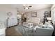 Bright living room with plush rug, modern furniture, and an open layout that connects to the dining and kitchen areas at 11475 Sw 85Th Ave, Ocala, FL 34481