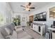 Sunroom features a large tv, many windows, and comfortable seating at 11475 Sw 85Th Ave, Ocala, FL 34481