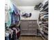 Spacious walk-in closet featuring a gray dresser, wire shelving, and ample storage for clothing and accessories at 11475 Sw 85Th Ave, Ocala, FL 34481