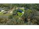 Aerial view of a home nestled among mature trees on a large lot offering privacy and seclusion at 11707 Se 101St Court Rd, Belleview, FL 34420