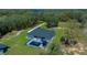 Expansive aerial view of the stunning property with a pool and lush landscaping surrounded by trees at 11707 Se 101St Court Rd, Belleview, FL 34420