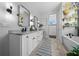 Spacious bathroom featuring double sinks, modern fixtures, walk-in shower and soaking tub at 11707 Se 101St Court Rd, Belleview, FL 34420