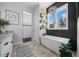 Elegant bathroom features a freestanding tub, modern lighting, and a walk in shower at 11707 Se 101St Court Rd, Belleview, FL 34420