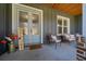Inviting front porch with stylish seating and a welcoming ambiance at 11707 Se 101St Court Rd, Belleview, FL 34420