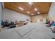 Large, unfinished garage with exposed ceiling, block walls, and concrete floor ready for any use at 11707 Se 101St Court Rd, Belleview, FL 34420