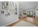 Bright living room with hardwood floors and view of the brick fireplace at 11707 Se 101St Court Rd, Belleview, FL 34420
