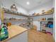 Walk-in pantry with custom built-in shelving, butcher block countertop and ample storage space at 11707 Se 101St Court Rd, Belleview, FL 34420