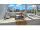Comfortable screened-in patio with neutral furnishings and decor at 11707 Se 101St Court Rd, Belleview, FL 34420