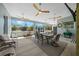 Spacious covered patio with ceiling fans and an outdoor dining area at 11707 Se 101St Court Rd, Belleview, FL 34420