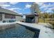 Home with a custom outdoor bar and glistening in-ground swimming pool at 11707 Se 101St Court Rd, Belleview, FL 34420