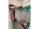Walk-in closet with shelves, clothes racks, carpet flooring, and plentiful storage space at 14191 Sw 115Th Ter, Dunnellon, FL 34432