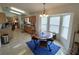 Bright dining area featuring a stylish table and chairs, set next to a sunny bay window at 14191 Sw 115Th Ter, Dunnellon, FL 34432