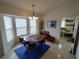 Bright dining area with tile flooring, and a bay window providing ample natural light at 14191 Sw 115Th Ter, Dunnellon, FL 34432