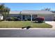 Well-maintained single-story home with green lawn and mature shrubbery at 14191 Sw 115Th Ter, Dunnellon, FL 34432